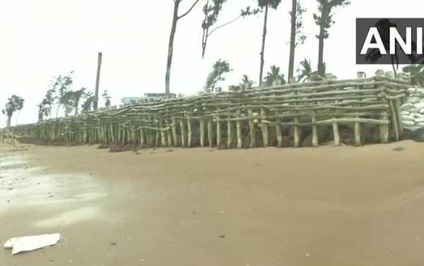 Indian Villagers Erect Temporary Fence Along the Coast to Reduce the Impact of Super Cyclone Amphan
