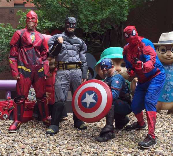 Superhero team brings smiles and clean windows to patients at children's hospital