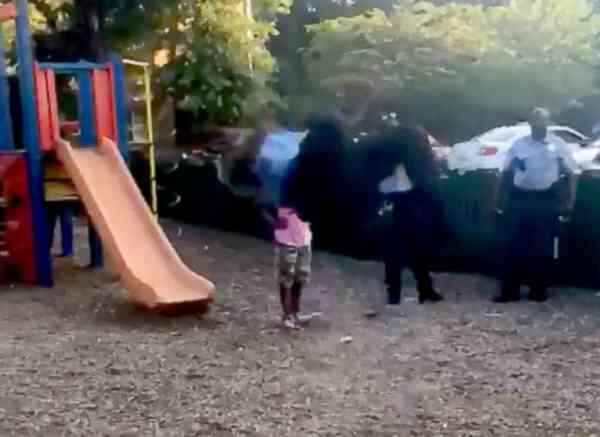 Watch this D.C. cop do gymnastics with local kids