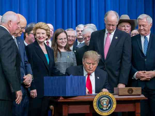 Trump signs farm bill, wants tighter food stamp restrictions