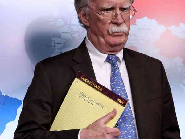 Bolton stokes questions, confusion with '5,000 troops' note during Venezuela briefing